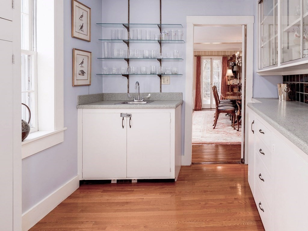 156 Larch Row Wenham, MA 01984 - Photo 11 of 38 a kitchen with cabinets and wooden floor