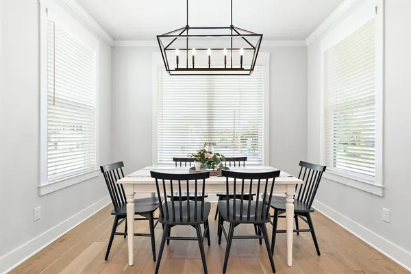 a view of a dining room with furniture and window