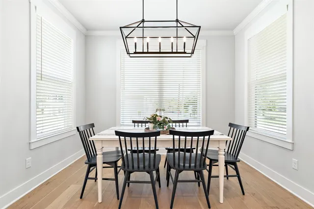 a view of a dining room with furniture and window