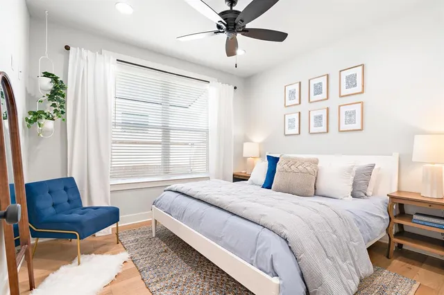 a spacious bedroom with a bed and a couch