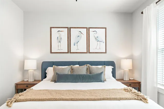 a large white bed in a white room