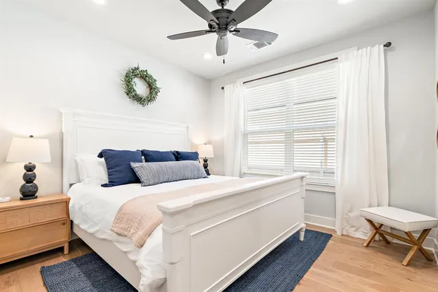 a bedroom with a bed and a desk