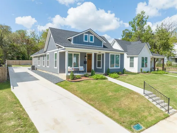 front view of a house with a yard