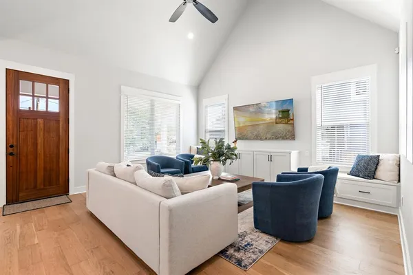a living room with furniture and a large window