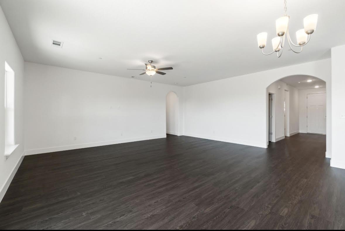 1207 Via Valencia Madera, CA 93637 - Photo 3 of 10 a view of an empty room with wooden floor