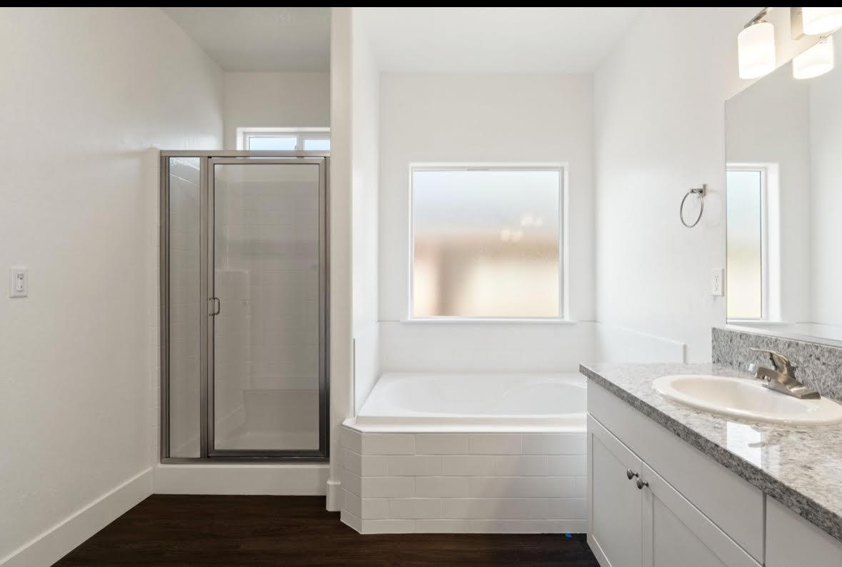 1207 Via Valencia Madera, CA 93637 - Photo 9 of 10 a bathroom with a granite countertop bathtub shower sink and mirror