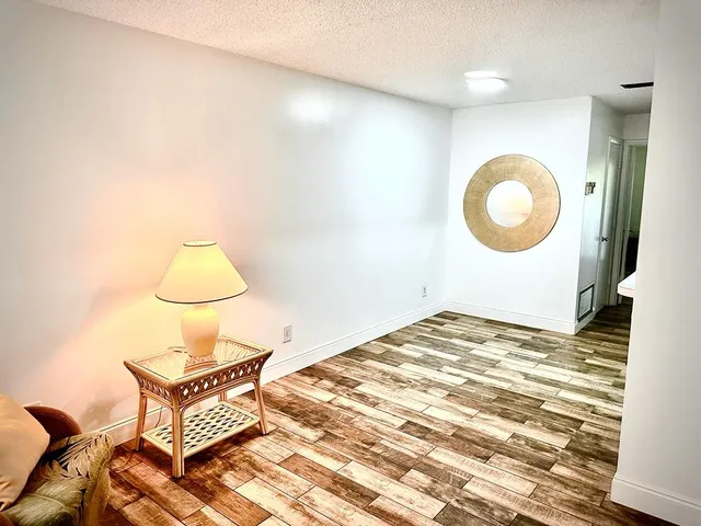 a view of an empty room with a large window