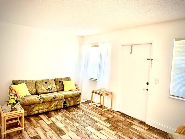 a bedroom with a bed and a chair