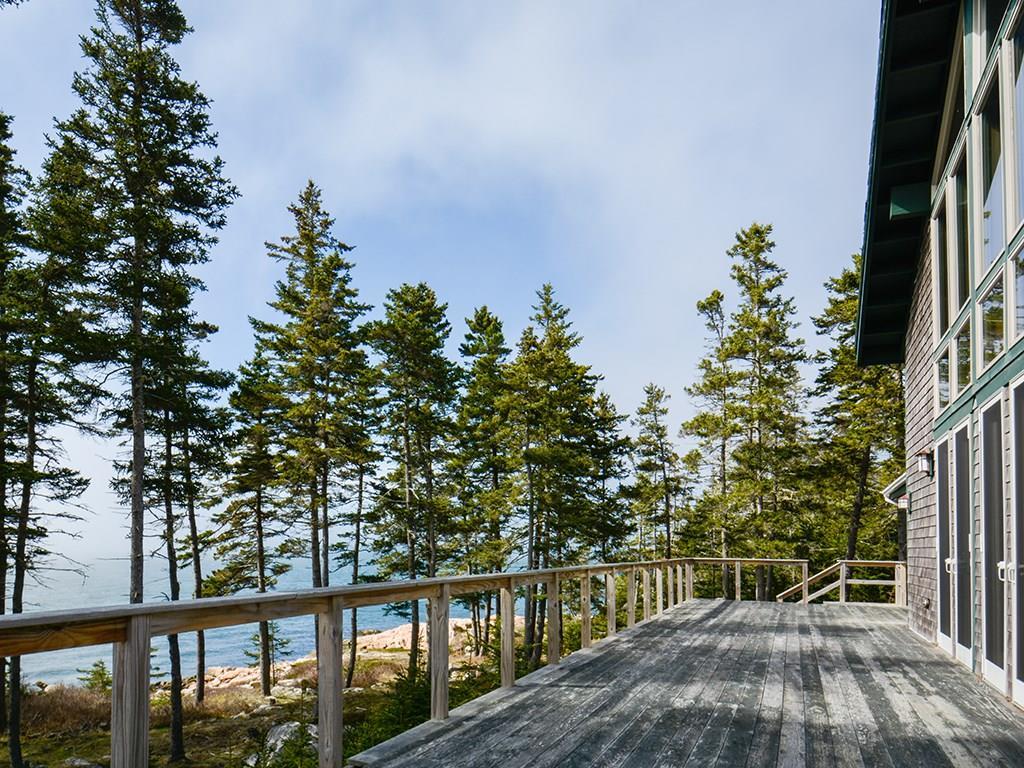 587 Jericho Bay Road Swans Island, ME 04685 - Photo 2 of 33 Expansive house length deck along...