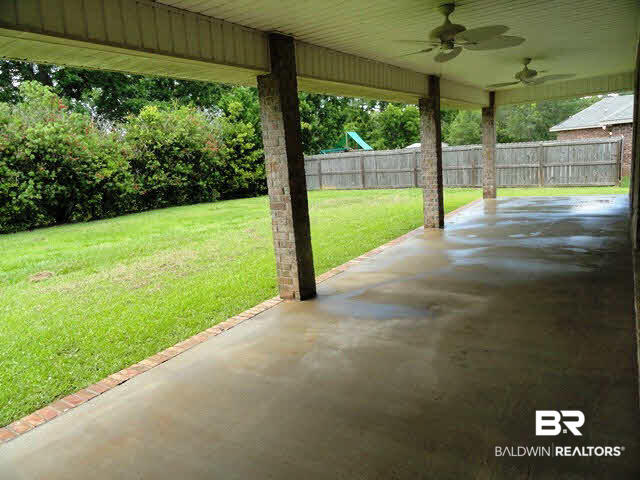 27927 Rileywood Drive Daphne, AL 36526 - Photo 20 of 24 Back Porch Has Ceiling Fans and Brick Columns Overlooking Private Backyard