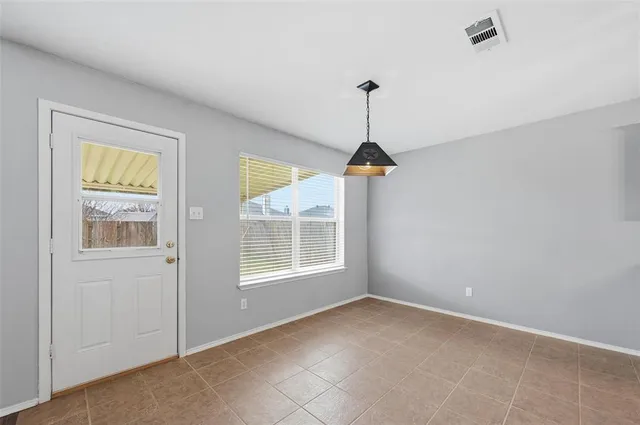 a view of empty room with windows