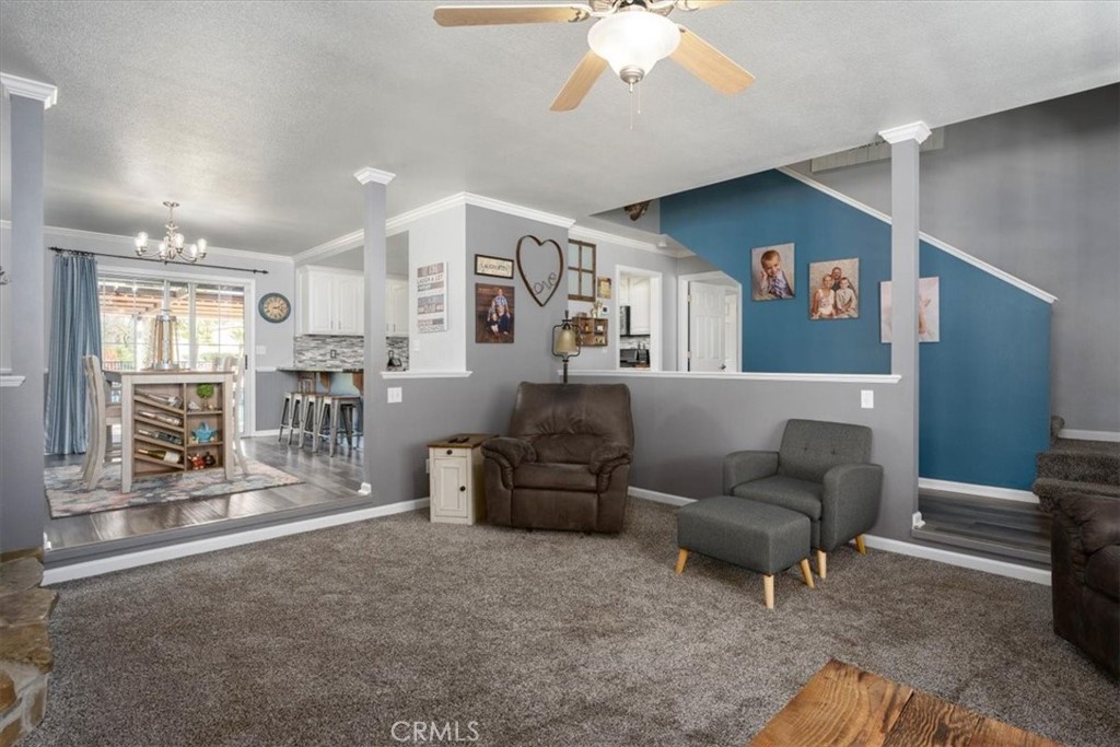 14720 McCoy Road Red Bluff, CA 96080 - Photo 12 of 49 a living room with furniture and a chandelier