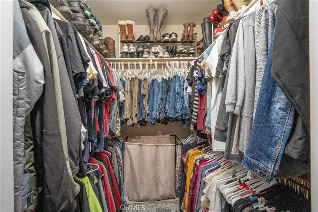 14720 McCoy Road Red Bluff, CA 96080 - Photo 16 of 49 a view of walk in closet with clothes