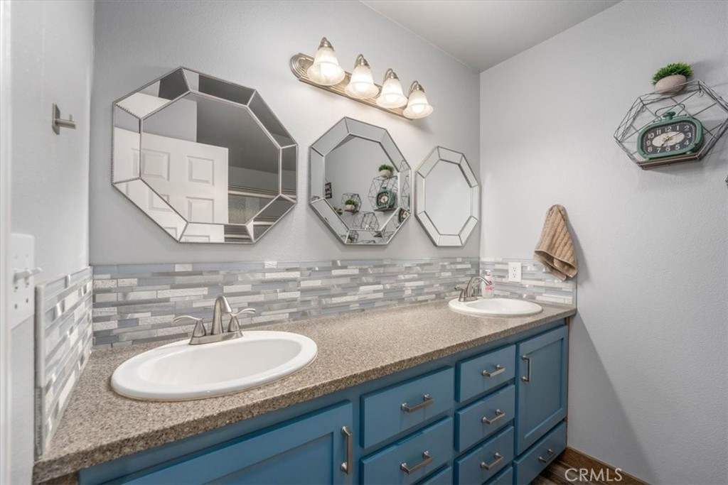 14720 McCoy Road Red Bluff, CA 96080 - Photo 17 of 49 a bathroom with a granite countertop double vanity sinks and a mirror
