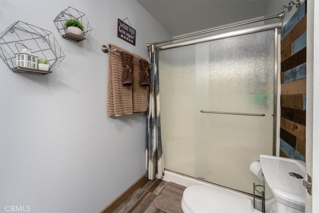 14720 McCoy Road Red Bluff, CA 96080 - Photo 18 of 49 a bathroom with a toilet and shower