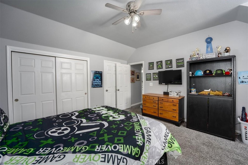 14720 McCoy Road Red Bluff, CA 96080 - Photo 22 of 49 a bedroom with a bed and a television