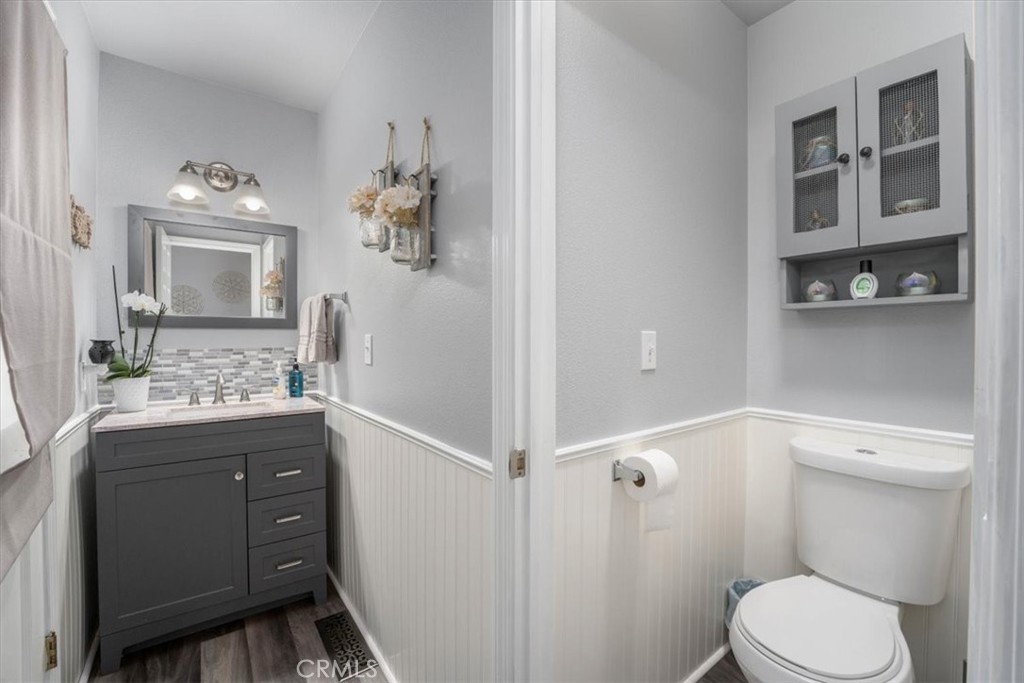 14720 McCoy Road Red Bluff, CA 96080 - Photo 26 of 49 a bathroom with a granite countertop sink toilet and shower