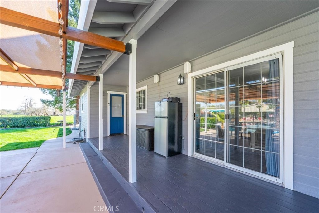 14720 McCoy Road Red Bluff, CA 96080 - Photo 30 of 49 a view of a porch with wooden floor and a yard