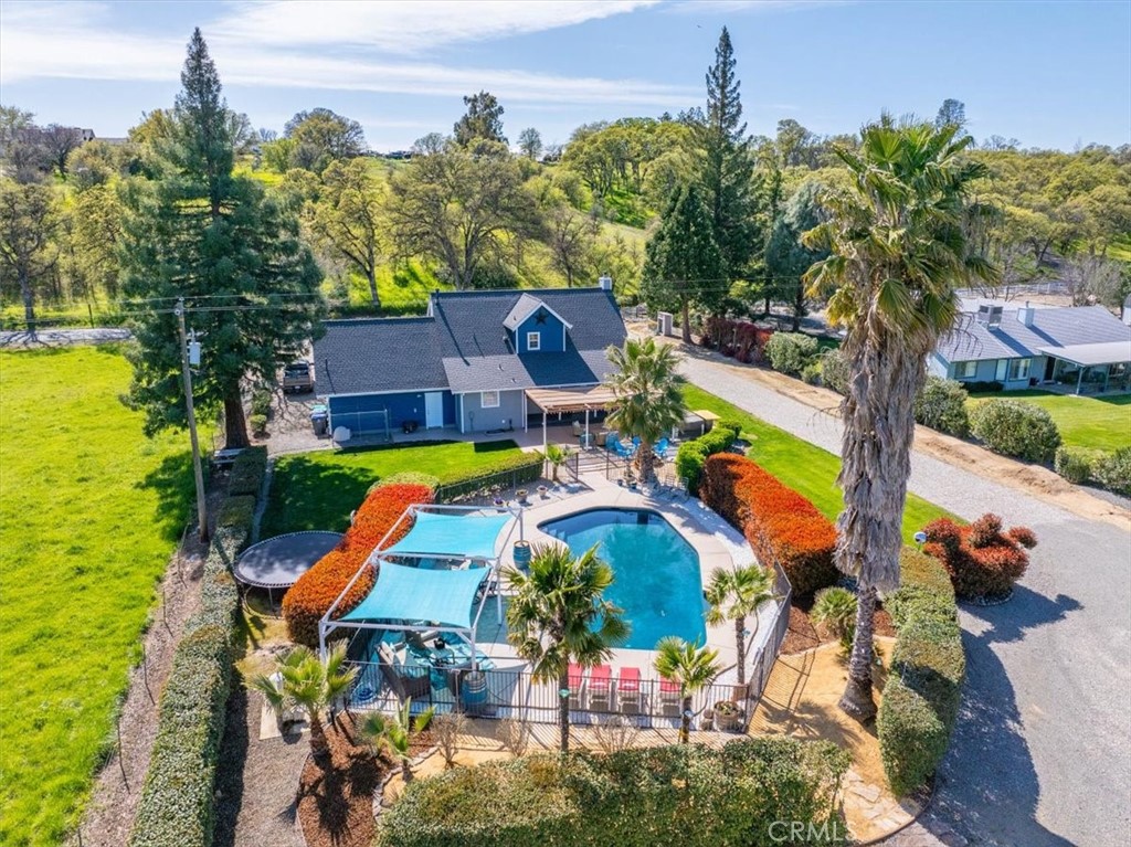 14720 McCoy Road Red Bluff, CA 96080 - Photo 3 of 49 aerial view of a house with swimming pool and porch