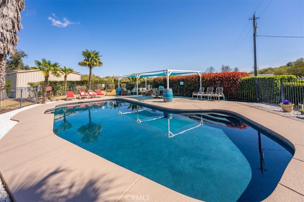 14720 McCoy Road Red Bluff, CA 96080 - Photo 35 of 49 a swimming pool with lawn chairs