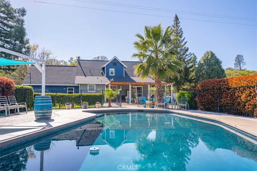 14720 McCoy Road Red Bluff, CA 96080 - Photo 36 of 49 a house with swimming pool in front of it
