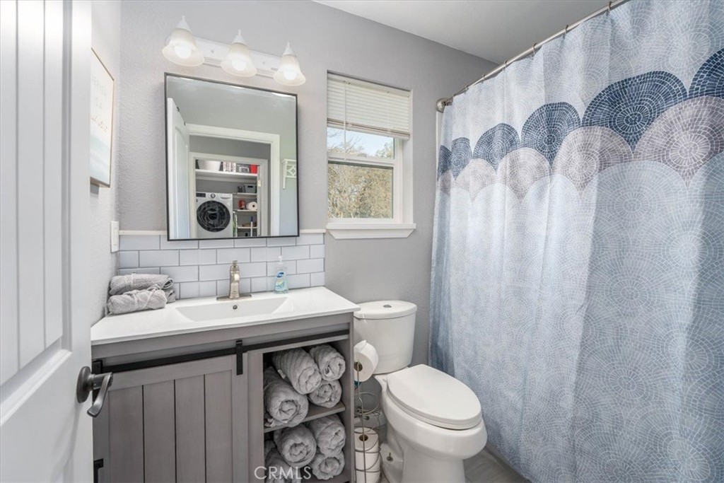 14720 McCoy Road Red Bluff, CA 96080 - Photo 42 of 49 a bathroom with a sink toilet and mirror