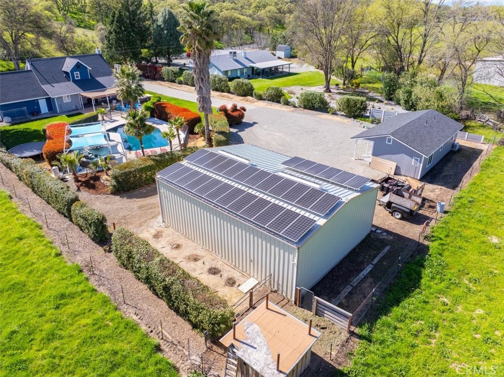 14720 McCoy Road Red Bluff, CA 96080 - Photo 47 of 49 an aerial view of a house with a garden and lake view