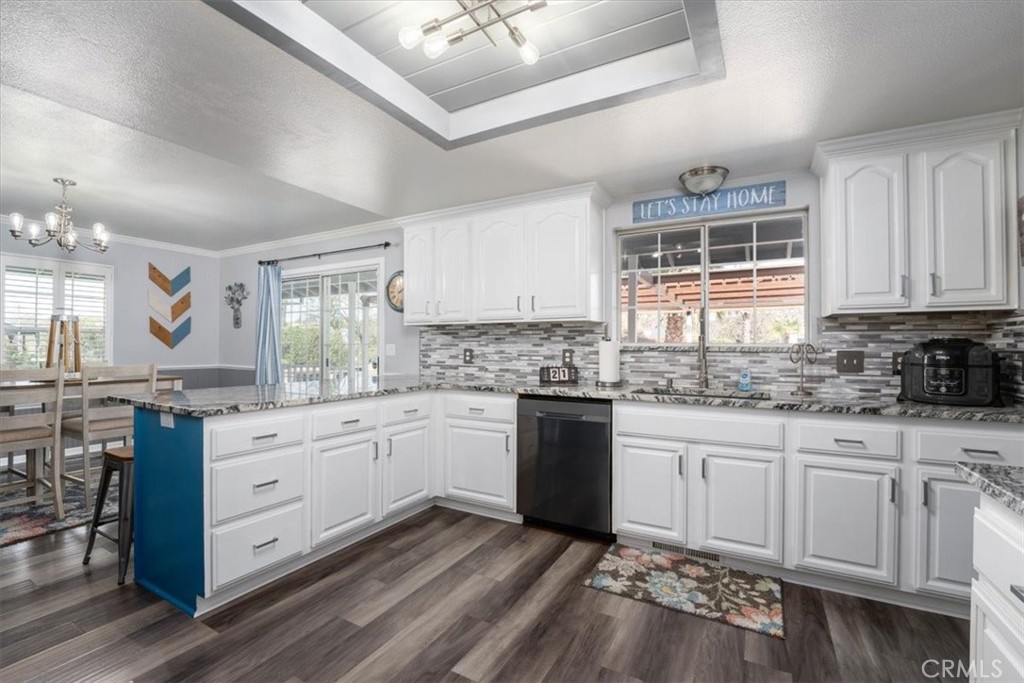 14720 McCoy Road Red Bluff, CA 96080 - Photo 7 of 49 a kitchen with granite countertop white cabinets and white appliances