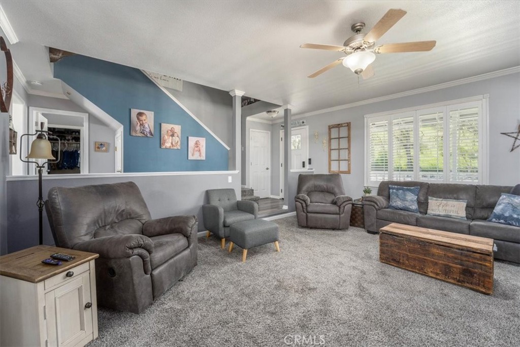 14720 McCoy Road Red Bluff, CA 96080 - Photo 10 of 49 a living room with furniture and a chandelier