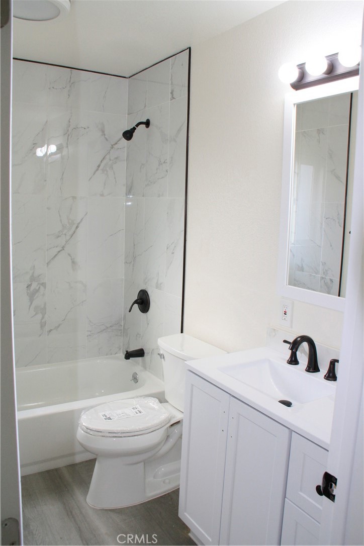 3928 Everest Avenue Riverside, CA 92503 - Photo 14 of 31 a bathroom with a sink a toilet and shower