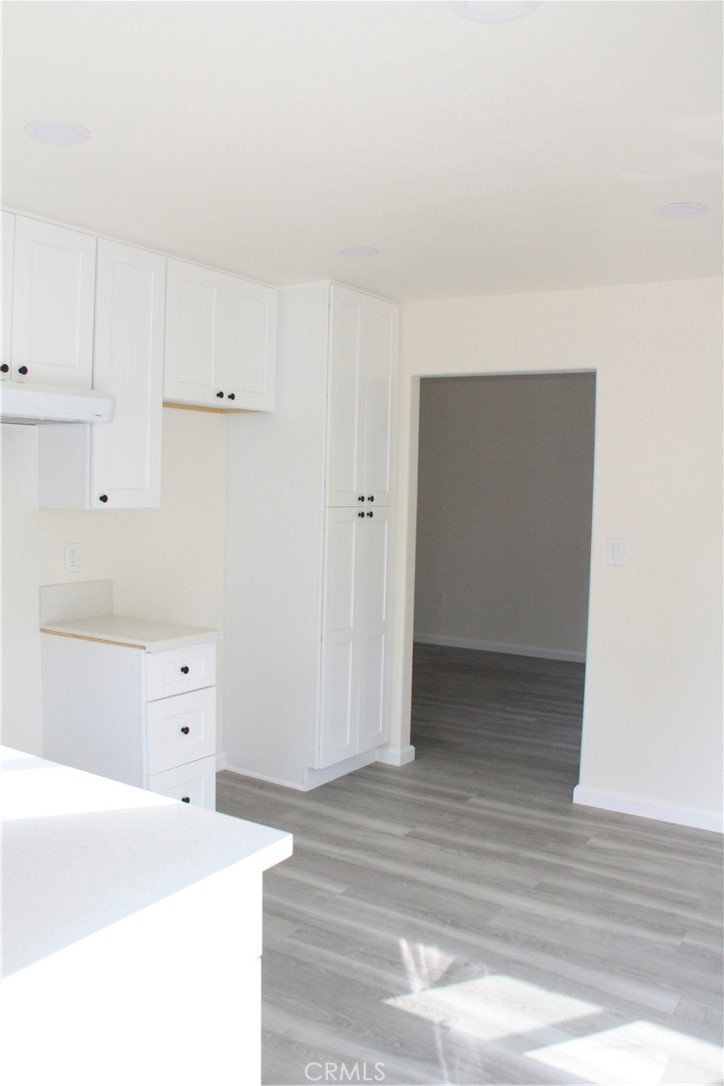 3928 Everest Avenue Riverside, CA 92503 - Photo 22 of 31 a view of an empty room with wooden floor