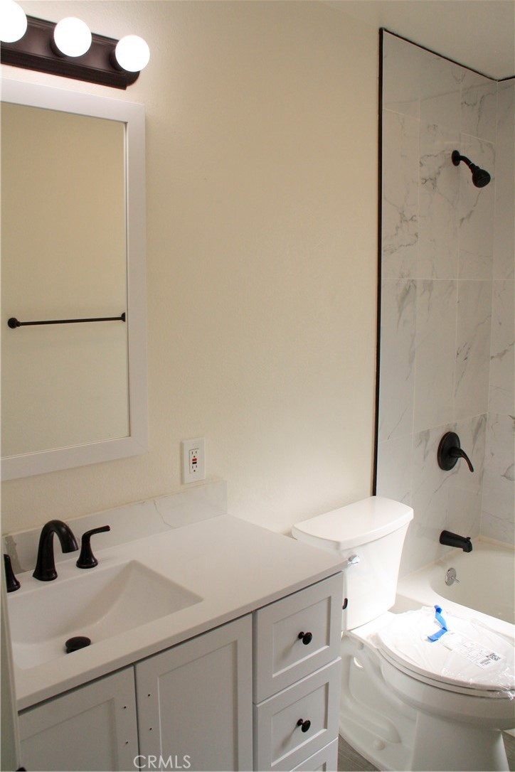 3928 Everest Avenue Riverside, CA 92503 - Photo 27 of 31 a bathroom with a sink and mirror