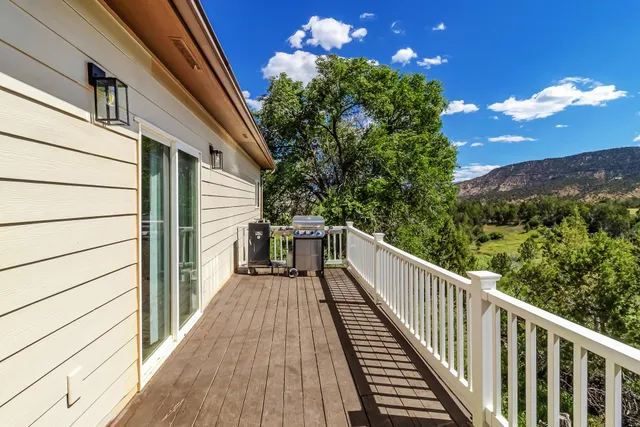 a view of balcony with wooden floor