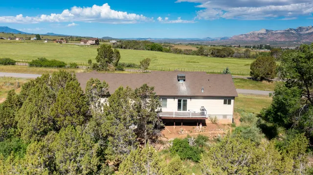 an aerial view of a house with a garden