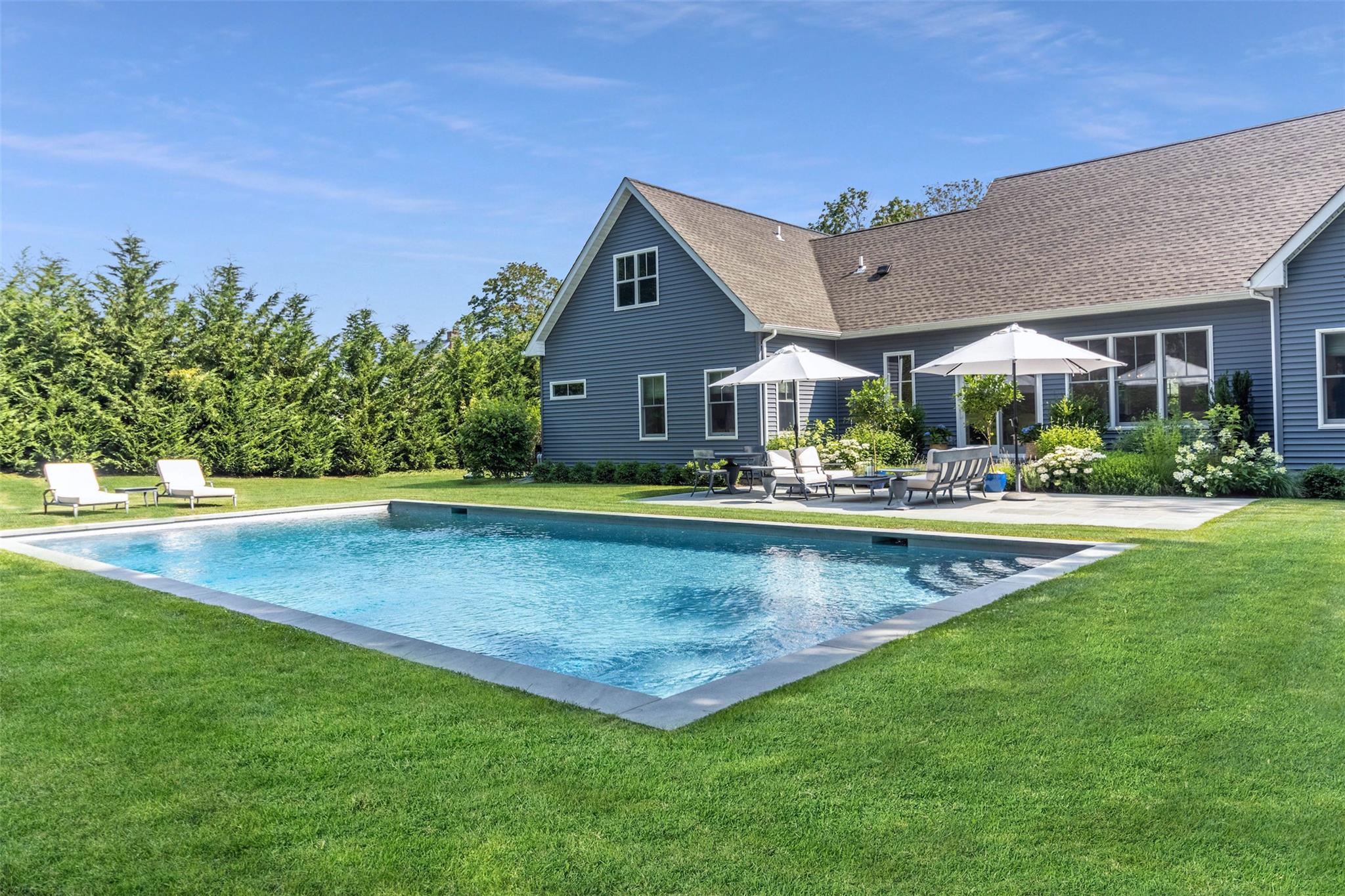 Pool featuring a patio and a yard