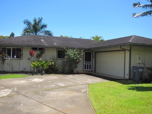 6700 Puupilo Road, Unit 1 Kapaa, HI 96746 - Photo 5 of 6 a front view of a house with a garden