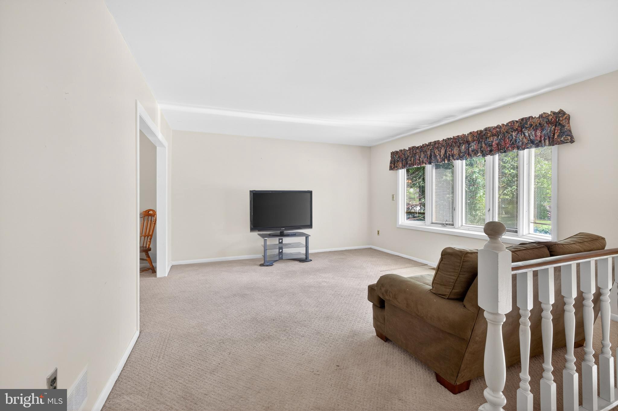 3701 Ebright Road Chadds Ford, PA 19317 - Photo 21 of 45 a living room with furniture and a flat screen tv