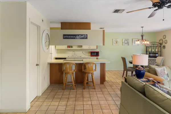 a bathroom with a sink mirror and toilet