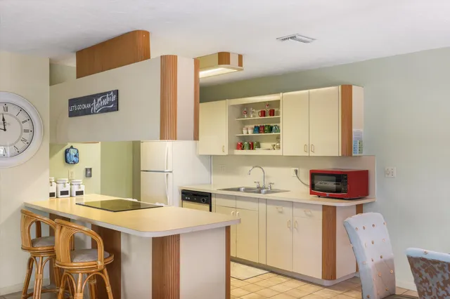 a kitchen with a sink and cabinets
