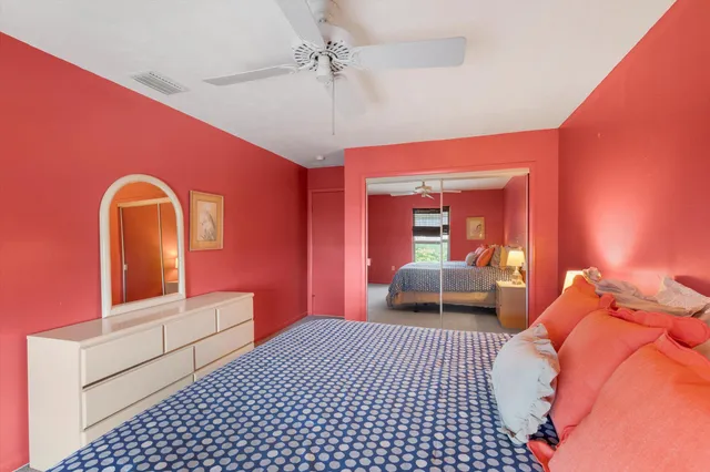 a bedroom with a bed and dresser