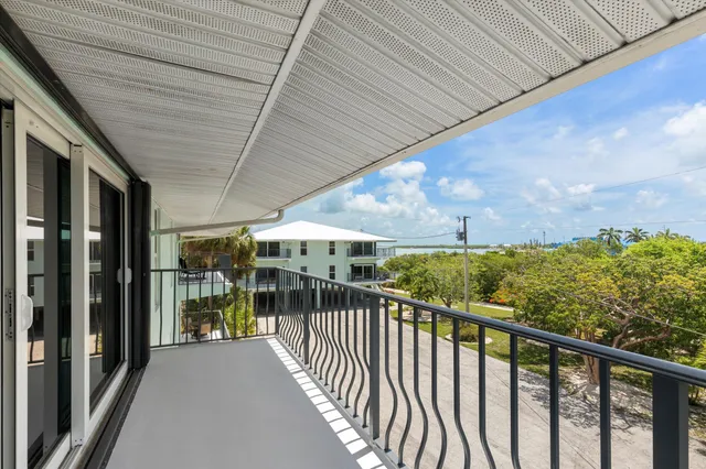 a view of a balcony with wooden floor