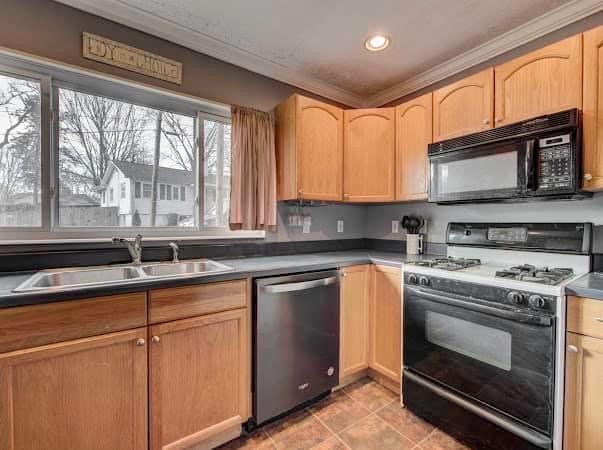 108 Powell Road Oak Ridge, TN 37830 - Photo 4 of 7 a kitchen with stainless steel appliances granite countertop a stove sink and microwave