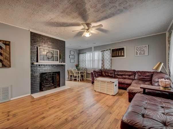 108 Powell Road Oak Ridge, TN 37830 - Photo 7 of 7 a living room with furniture and a fireplace