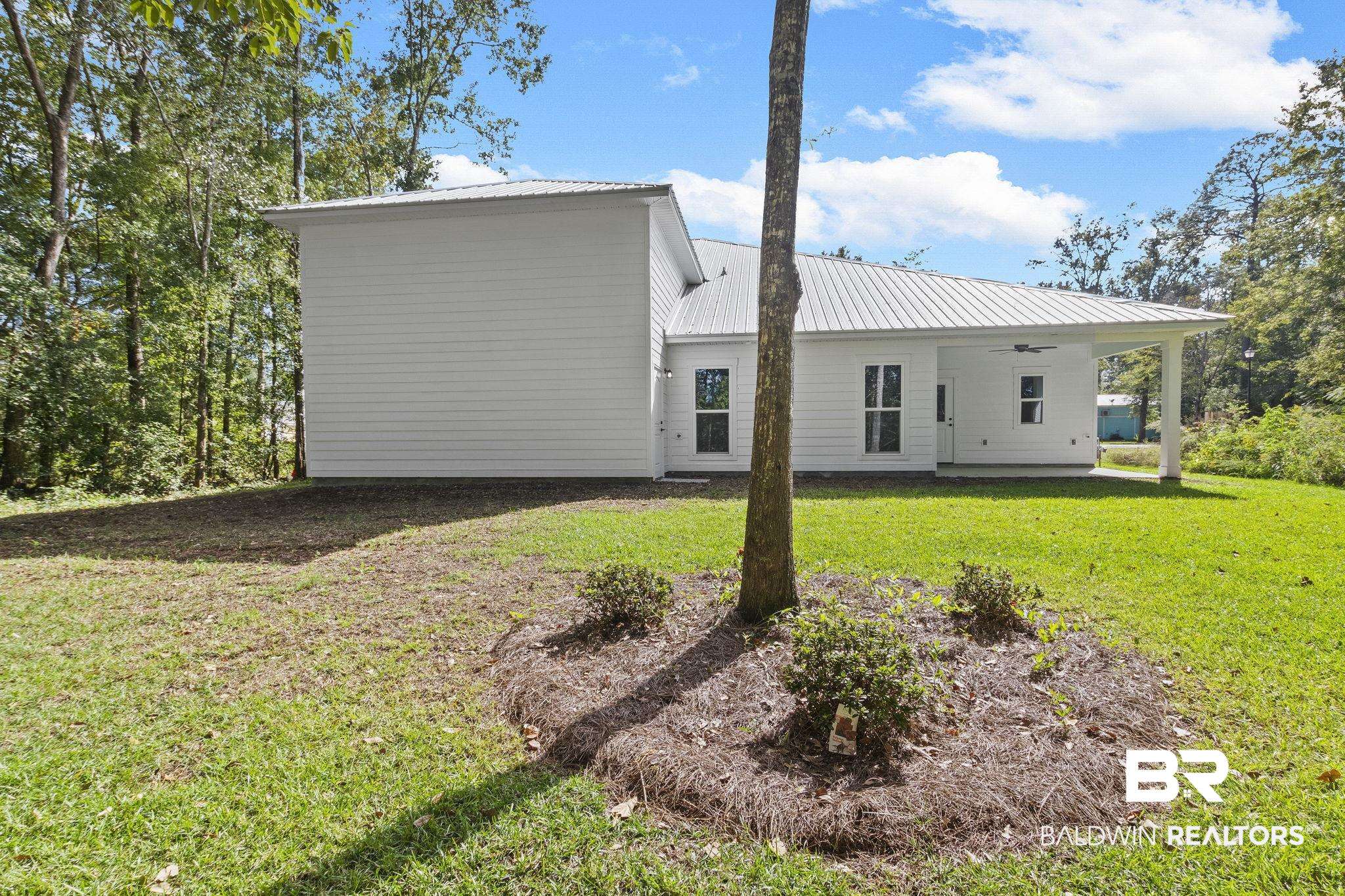 12130 Reunion Place Foley, AL 36535 - Photo 39 of 42 Rear view of property with a lawn