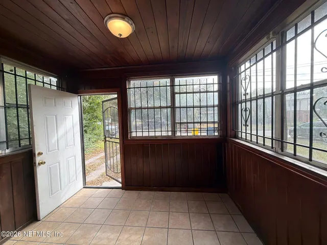 a view of an empty room with a window