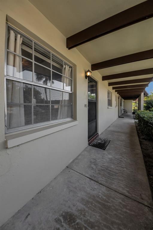 1701 Pinehurst Road, Unit 4F Dunedin, FL 34698 - Photo 15 of 56 a view of empty room with windows