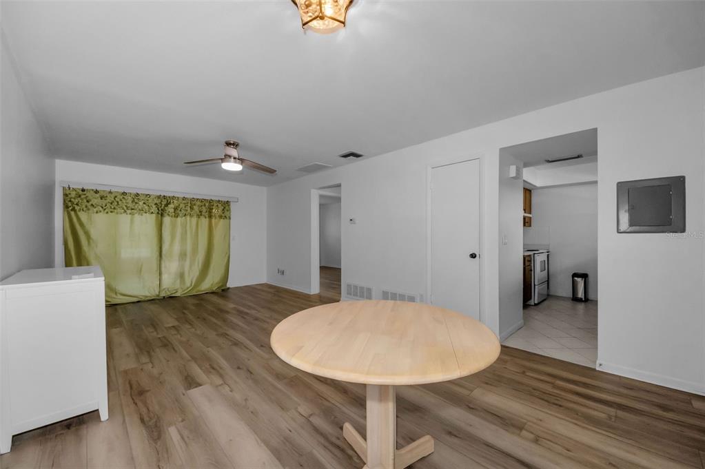 1701 Pinehurst Road, Unit 4F Dunedin, FL 34698 - Photo 17 of 56 a view of a livingroom with a table and chair