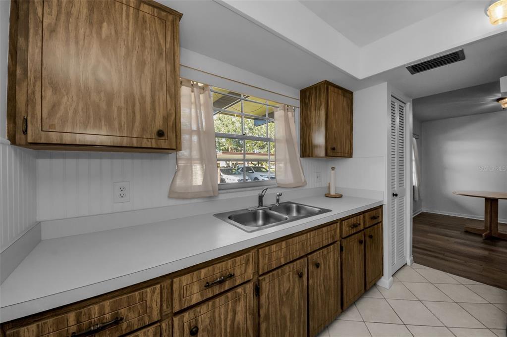 1701 Pinehurst Road, Unit 4F Dunedin, FL 34698 - Photo 20 of 56 a kitchen with a sink and cabinets