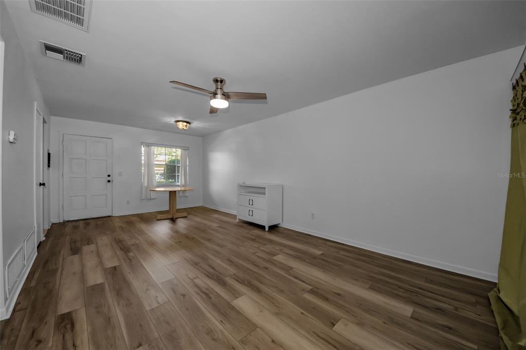 1701 Pinehurst Road, Unit 4F Dunedin, FL 34698 - Photo 21 of 56 wooden floor in an empty room with a window