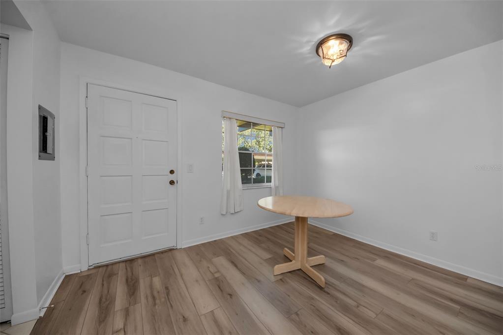 1701 Pinehurst Road, Unit 4F Dunedin, FL 34698 - Photo 22 of 56 a view of a room with a door and wooden floor